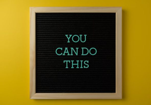 Inspirational message 'You Can Do This' displayed on a blackboard with a bold yellow backdrop.
